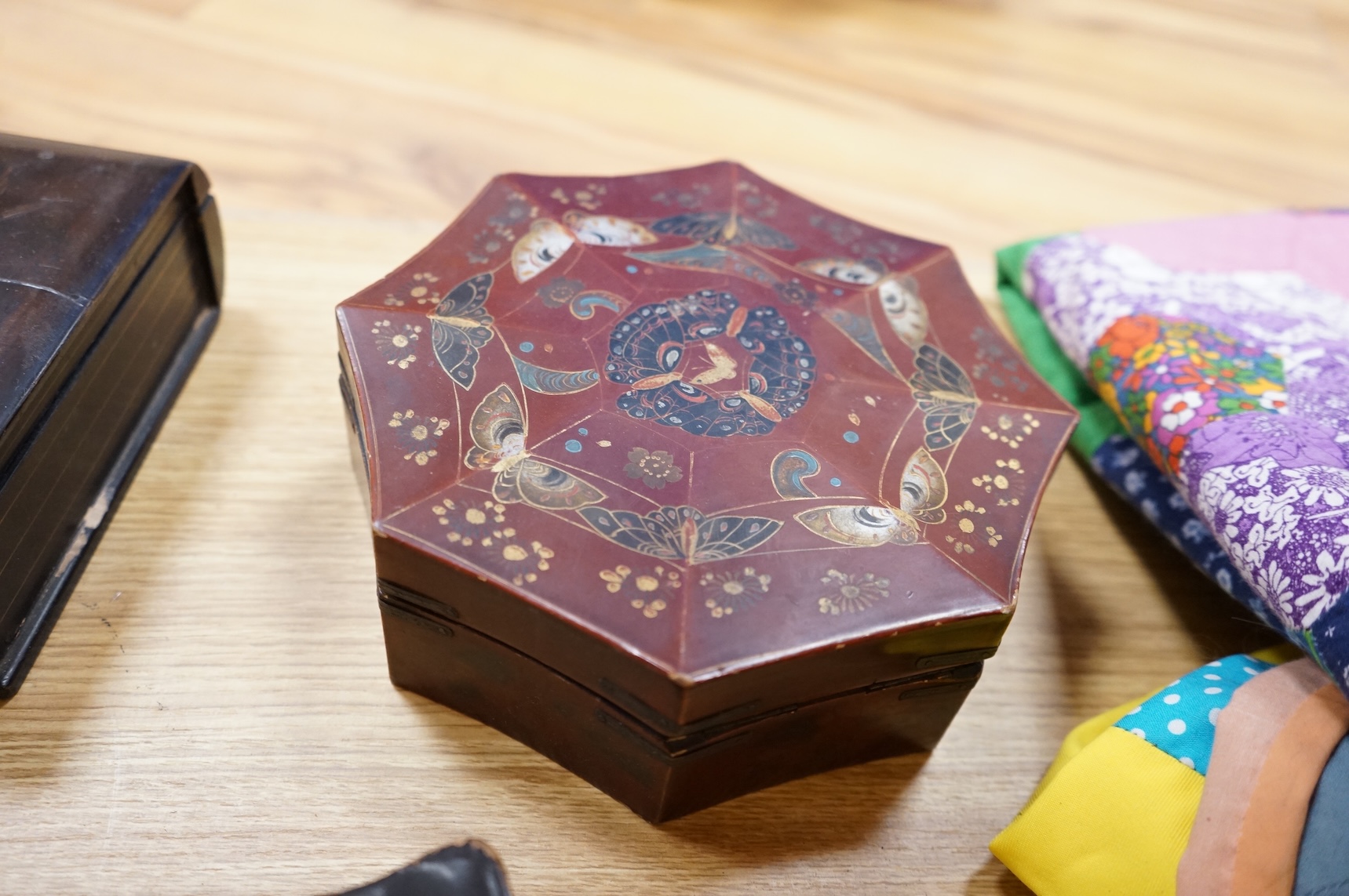 A group of 19th/20th century Japanese lacquer boxes and a similar tabletop cabinet, the latter 31cm wide